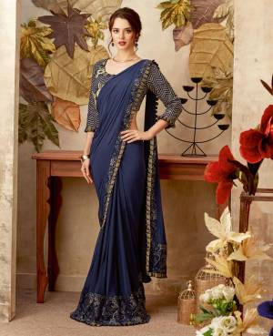 Arise with an ethereal charm in this one-of-a-kind navy blue pre-pleated saree. The hem details make this design a calss apart. 