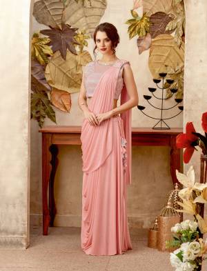 This pink beauty favours every skin tone. Mirror feminine grandeur in this pre-pleated skirt-saree and be the talk of the town.