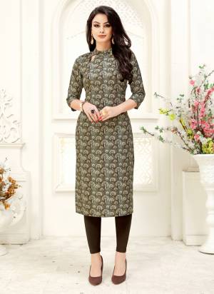 Add This Lovely Kurti To Your Wardrobe In Brown And Grey Color Fabricated on Crepe. It Has Pretty Small Prints All Over It. Buy Now.