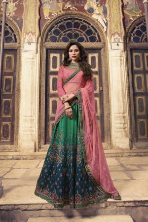 Here Is A Lovely Shaded Designer Lehenga Choli In Pink Colored Blouse And Dupatta Paired With Shaded Lehenga In Green And Blue Color. This Lehenga Choli Is Fabricated On Soft Silk Paired With Net Dupatta. 
