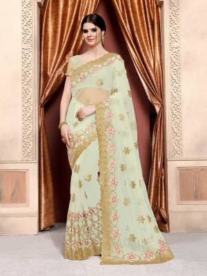 Here Is Very Pretty Shade In Green With This Designer Saree In Mint Green Color Paired With Mint Green Colored Blouse. This Saree And Blouse Are Fabricated On Net Beautified With Heavy Embroidery.