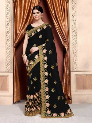 For A Bold And Beautiful Look, Grab This Designer Saree In Black Color Paired With Black Colored Blouse. This Saree And Blouse Are Net Based Beautified With Attractive Work Over. Buy This Now.