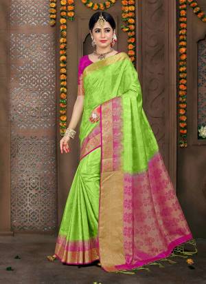 Pretty Looking Saree Is Here In Light Green Color Paired With Contrasting Rani Pink Colored Blouse. This Saree And Blouse are Fabricated On Embossed Jacquard Beautified With Weave All Over It .