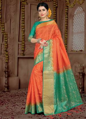 Celebrate This Festive Season Wearing This Silk Based Saree In Orange Color Paired With Contrasting Sea Green Colored Blouse. This Saree And Blouse Are Fabricated on Embossed Jacquard. This Lovely Saree Gives A Rich look To Your Personality. 