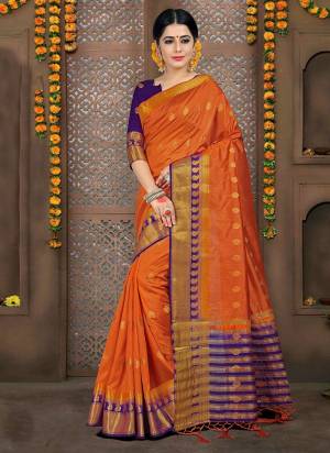 Celebrate This Festive Season Wearing This Silk Based Saree In Orange Color Paired With Contrasting Violet Colored Blouse. This Saree And Blouse Are Fabricated on Art Silk, This Lovely Saree Gives A Rich look To Your Personality. 