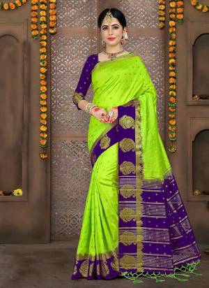 Bright And Visually Appealing Color Is Here With This Saree In Parrot Green Color Paored With Contrasting Violet Colored Blouse. This Saree And Blouse Are Fabricated On Art Silk. 