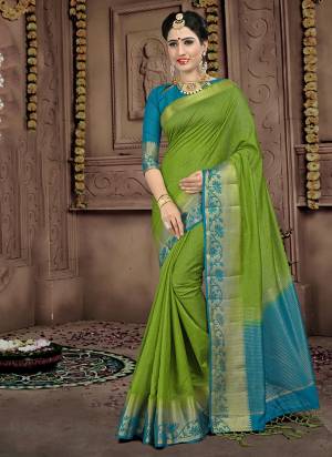 Look Pretty Wearing this Silk Based Saree In Green Color Paired With Contrasting Turquoise Blue Colored Blouse. This Saree And Blouse Are Fabricated On Linen Silk Beautified With Weave. This Rich Fabric Gives An Elegant Look To Your Personality. 