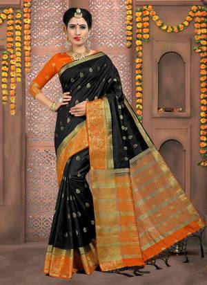 For A Bold And Beautiful Look, Grab This Silk Based Saree In Black Color Paired With Orange Colored Blouse. This Saree And Blouse Are Fabricated On Art Silk Beautified With Weave. 