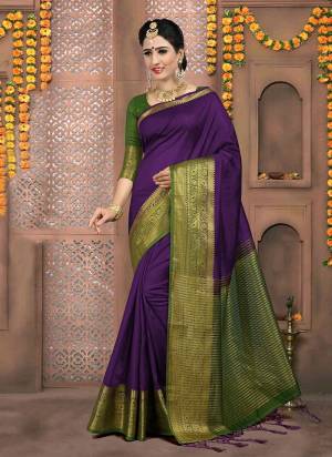 Celebrate This Festive Season Wearing This Silk Based Saree In Violet Color Paired With Contrasting Dark Green Colored Blouse. This Saree And Blouse Are Fabricated on Art Silk, This Lovely Saree Gives A Rich look To Your Personality. 