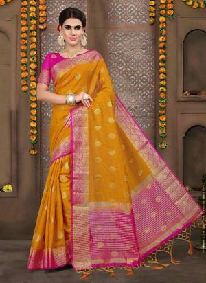Look Pretty Wearing this Silk Based Saree In Musturd Yellow Color Paired With Contrasting Fuschia Pink Colored Blouse. This Saree And Blouse Are Fabricated On Linen Silk Beautified With Weave. This Rich Fabric Gives An Elegant Look To Your Personality. 