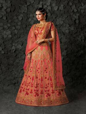 Look Pretty In Shades Of Pink With This Heavy Designer Lehenga Choli In Dark Pink Colored Blouse Paired With Pink Colored lehenga And Dupatta. It IS Silk Based paired With Net Fabricated Dupatta. 