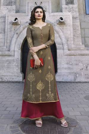 Flaunt Your Rich And Elegant Taste Wearing This Designer Readymade Layered Long Kurti In Beige And Dark Pink Color. It Is Fabricated On Jacquard silk And Satin. Both Its Fabrics Ensures Superb Comfort All Day Long. 