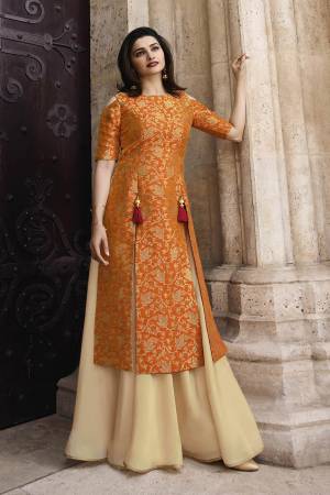 Celebrate This Festive Season Wearing This Designer Readymade Kurti In Orange And Cream Color Fabricated On Jacquard Silk And Satin. This Kurti Has Pretty Weave With Designer Tassels. 