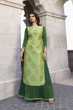 Go With The Shades Of Green Wearing This Designer Long Kurti In Light Green And Green Color Fabricated On Jacquard Silk And Satin. This Kurti Is Light In Weight and Its Has Pretty Weave With Attractive Stone Work. Buy Now.