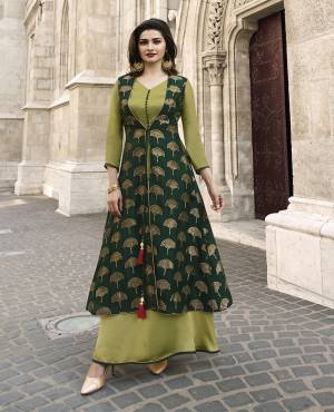 Go With The Shades Of Green Wearing This Designer Long Kurti In Dark Green And Light Green Color Fabricated On Jacquard Silk And Satin. This Kurti Is Light In Weight and Its Has Pretty Weave With Attractive Stone Work. Buy Now.
