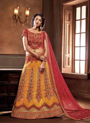 Bright And Appealing Color Is Here With This Heavy Designer Lehenga Choli In Dark Pink Colored Blouse And Dupatta Paired With Contrasting Musturd Yellow Colored Lehenga. Its Blouse And Lehenga Are Silk Based Paired With Net Fabricated Dupatta.