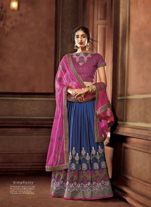 You Will Definitely Earn Lots Of Compliments In This Designer Lehenga Choli In Magenta Pink Colored Blouse And Dupatta Paired With Blue Colored Lehenga. This Lehenga Choli Is Silk Based Paired With Net Fabricated Dupatta. 