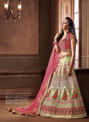 Look The Most Preetiest Of All Wearing This Heavy Designer Lehenga Choli On Pink Colored Blouse And dupatta Paired With Contrasting Light Green Colored Lehenga. Its Blouse And Lehenga Are Silk Based Paired With Net Fabricated Dupatta. Buy Now.