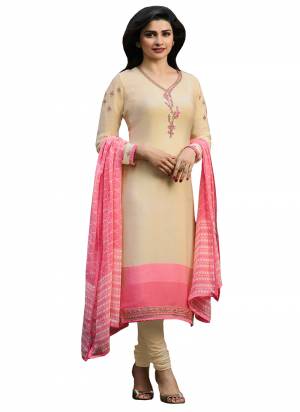 Simple And Elegant Looking Designer Straght Suit Is Here In Cream Color Paired With Pink Colored Dupatta. This Suit Is Crepe Based Paired With Chiffon Dupatta. Buy This Semi-Stitched Suit Now.