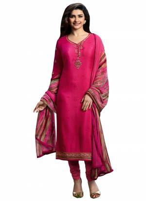 Bright And Appealing Color Is Here With This Designer Semi-Stitched Suit In Dark Pink Color Paired With Multi Colored Dupatta. Its Top And Bottom Are Crepe Fabricated Paired With Chiffon Dupatta. It Has Prints And Embroidery giving It An Attractive Look. 