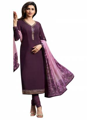 Look Pretty In This Designer Straight Cut Suit In Dark Purple Color paired With Lavendor Colored Dupatta. Its Top And Bottom Are Fabricated On Crepe Paired With Chiffon Dupatta. It Is Beautified With Floral Prints Over Dupatta And Embroidery Over The Top.