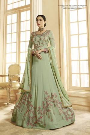 This Season Is About Subtle Shades And Pastel Play, So Grab This Designer Floor Length Suit In Pastel Green Color Paired With Pastel Green Colored Bottom And Dupatta. It Is Georgette Based Beautified With Heavy Embroidery. Buy This Semi-Stitched Suit Now.