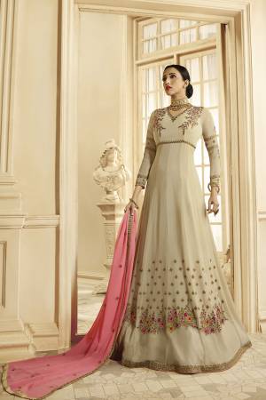 Simple And Elegant Looking Designer Floor Length Suit Is Here In Cream Color Paired With Pink Colored Dupatta. As it IS Georgette Based, It Is Light In Weight And Easy To Carry All Day Long. 