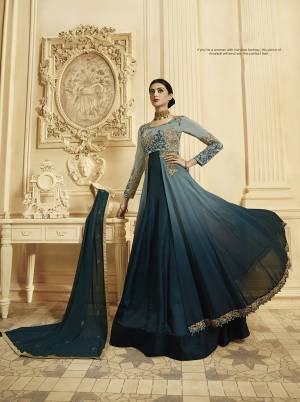 Here Is A Lovely Designer Floor Length Suit In Shades Of Blue, Grab This Designer Floor Length Suit In Steel Blue And Prussian Blue Color Paired With Prussian Blue Colored Bottom And Dupatta. Iit Is Georgette Based Beautified With Heavy Attractive Embroidery. 