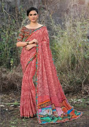 Here Is A Very Pretty Dark Peach Colored Saree Paired With Multi Colored Blouse. This Saree And Blouse Are Fabricated On Satin Georgette Beautified With Floral Prints. 