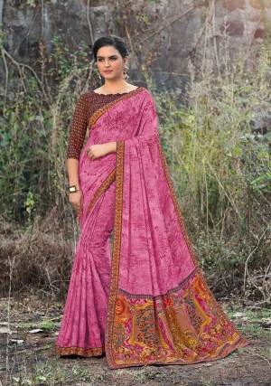 Look Pretty In This Pretty Pink Colored Saree Paired With Contrasting Brown Colored Blouse. This Saree And Blouse Are Fabricated On Satin Georgette Beautified With Prints All Over. 