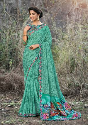 For Your Semi-Casual Wear, Grab This Pretty Saree In Sea Green Color Paired With Multi Colored Blouse. This Saree And Blouse Are Fabricated On Satin Georgette Beautified With Prints All Over. 