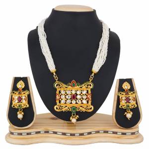Enhance Your Ethnic Look With This Designer Necklace Set Beautified With Pearl And Stone Work. It Can Be Paired With A Silk Saree, Lehenga Or Any Traditional Attire. Buy Now.