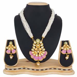 Enhance Your Ethnic Look With This Designer Necklace Set Beautified With Pearl And Stone Work. It Can Be Paired With A Silk Saree, Lehenga Or Any Traditional Attire. Buy Now.