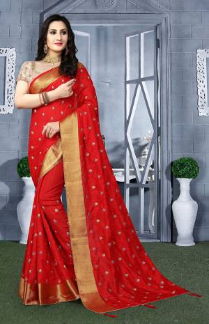 Celebrate This Festive Season wearing This Designer Saree In Red Color Paired With Beige Colored Blouse. This Saree IS Silk Based With Bricade Fabricated Blouse. It Is Easy To Carry And Durable. 