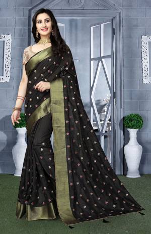 Here Is A Beautiful Designer Silk Based Saree In Black Color Paired With Beige Colored Blouse. This Saree Is Fabricated On Art Silk Paired With Brocade Fabricated Blouse. It Has Pretty Embroidered Motifs All Over. 