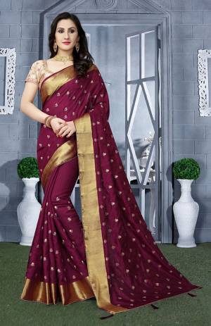 Here Is A Beautiful Designer Silk Based Saree In Wine Color Paired With Beige Colored Blouse. This Saree Is Fabricated On Art Silk Paired With Brocade Fabricated Blouse. It Has Pretty Embroidered Motifs All Over. 