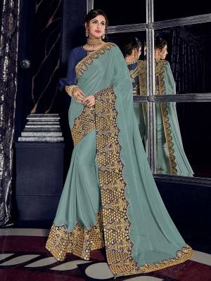 Presenting this Steel Blue color bright georgette saree. Ideal for party, festive & social gatherings. this gorgeous saree featuring a beautiful mix of designs. Its attractive color and designer heavy embroidered design, Flower patch design, zari resham and sequence work, stone design, beautiful floral design work over the attire & contrast hemline adds to the look. Comes along with a contrast unstitched blouse.