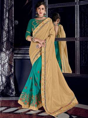you Look striking and stunning after wearing this Cream And Turquoise Blue color silk fabrics and two tone silk fabrics saree. look gorgeous at an upcoming any occasion wearing the saree. this party wear saree won't fail to impress everyone around you. Its attractive color and designer heavy embroidered design, Flower patch design, zari resham and work, stone design, beautiful floral design work over the attire & contrast hemline adds to the look. Comes along with a contrast unstitched blouse.