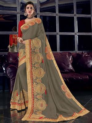 You can this amazing saree from and look pretty like never before. wearing this grey color silk fabrics saree. this gorgeous saree featuring a beautiful mix of designs. look gorgeous at an upcoming any occasion wearing the saree. Its attractive color and designer heavy embroidered design, Flower patch design, zari resham work, stone design, beautiful floral design work over the attire & contrast hemline adds to the look. Comes along with a contrast unstitched blouse.