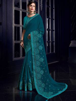 Impress everyone with your amazing Trendy look by draping this peacock blue color silk fabrics saree. this party wear saree won't fail to impress everyone around you. this gorgeous saree featuring a beautiful mix of designs. Its attractive color and designer heavy embroidered design, Flower patch design, beautiful floral design work over the attire & contrast hemline adds to the look. Comes along with a contrast unstitched blouse.