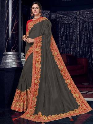 Presenting this Dark Grey color silk fabrics saree. look gorgeous at an upcoming any occasion wearing the saree. this party wear saree won't fail to impress everyone around you. Its attractive color and designer heavy embroidered design, Flower patch design, zari resham work, stone design, beautiful floral design work over the attire & contrast hemline adds to the look. Comes along with a contrast unstitched blouse.