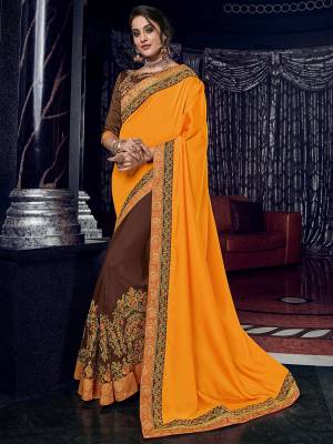 Presenting This Yellow and brown color two tone silk fabrics and silk fabrics saree. Ideal for party, festive & social gatherings. this gorgeous saree featuring a beautiful mix of designs. Its attractive color and designer heavy embroidered design, Flower patch design, zari resham work, stone design, beautiful floral design work over the attire & contrast hemline adds to the look. Comes along with a contrast unstitched blouse.