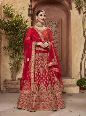 Adorn The Amazing Bridal Look In This Lovely Heavy Designer Lehenga Choli In Red Color. This Lehenga Choli Is Fabricated On Satin Silk Paired With Net Fabricated Dupatta. It Is Beautified With Jari Embroidery And Stone Work. Buy Now.