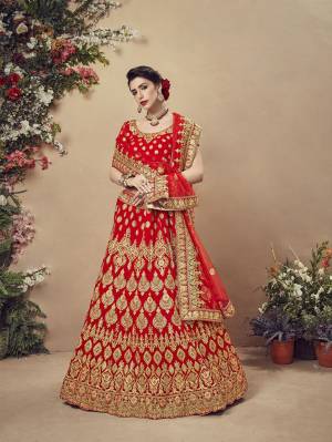 Here Is A Perfect Bridal Look For You With This Heavy designer Lehenga Choli In Red Color. This Lehenga Choli Is Velvet Based Paired With Net Fabricated Dupatta.Its Fabric Also Ensures Superb Comfort Throughout The Gala. 