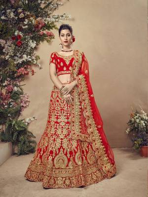 Get Ready For Your Big Day With This Heavy Designer Lehenga Choli In Red Color. This Heavy Embroidered Lehenga Choli Is Fabricated On Velvet Paired With Net Fabricated Dupatta. It Is Beautified With Heavy Jari Embroidery and Stone Work. Buy Now. 