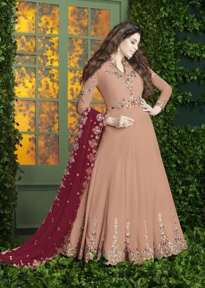 Simple And Elegant Looking, Designer Floor Length Suit Is Here In Peach Color Paired With Peach Colored Bottom And Red Colored Dupatta. Its Top And Dupatta Are Fabricated On Georgette Paired With Santoon Bottom. Its Pretty Color And Embroidery Will Earn You Lots Of Compliments From Onlookers. Buy Now.