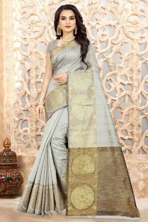 Flaunt Your Rich And Elegant Taste In This Grey Colored Saree Paired With Grey Colored Blouse. This Saree And Blouse Are Linen Silk Based Beautified With Weave. Buy Now.