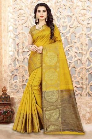 Celebrate This Festive Season Wearing This Attractive Yellow Colored Saree Paired With Yellow Colored Blouse. This Saree And Blouse Are Linen Silk Based Beautified With Weave All Over It. 