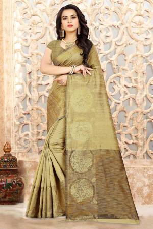 Flaunt Your Rich And Elegant Taste In This Beige Colored Saree Paired With Beige Colored Blouse. This Saree And Blouse Are Linen Silk Based Beautified With Weave. Buy Now.