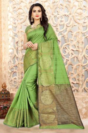 Celebrate This Festive Season Wearing This Attractive Green Colored Saree Paired With Green Colored Blouse. This Saree And Blouse Are Linen Silk Based Beautified With Weave All Over It. 